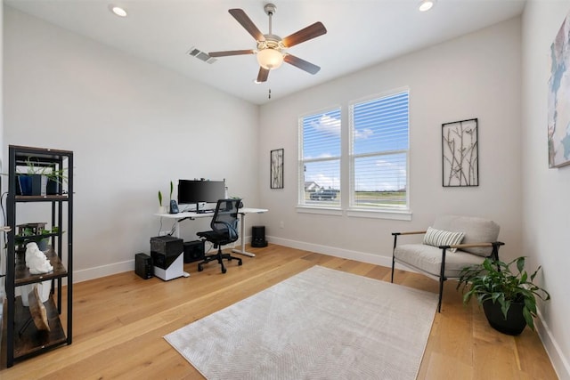 office area featuring light wood-style flooring, recessed lighting, visible vents, and baseboards