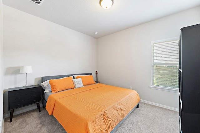 bedroom featuring carpet floors and baseboards