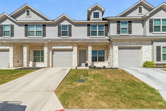 view of property featuring a garage, concrete driveway, stone siding, a front lawn, and stucco siding