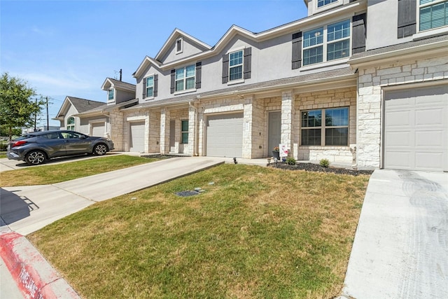 townhome / multi-family property featuring a garage, concrete driveway, stone siding, stucco siding, and a front yard