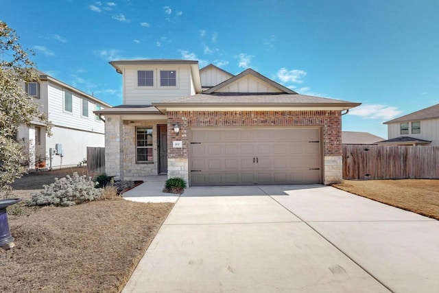 view of front facade with an attached garage, fence, concrete driveway, stone siding, and board and batten siding