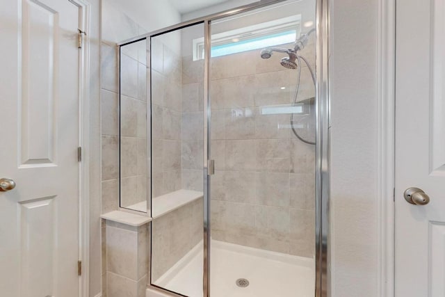 full bathroom featuring a stall shower