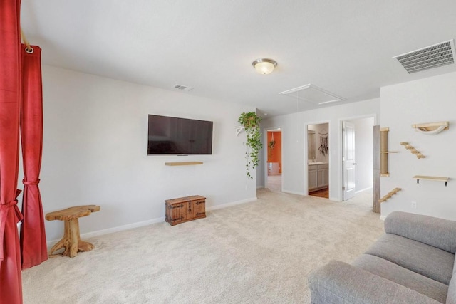 carpeted living room featuring baseboards and visible vents