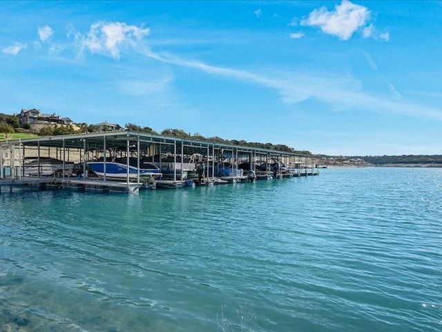 view of dock featuring a water view and boat lift