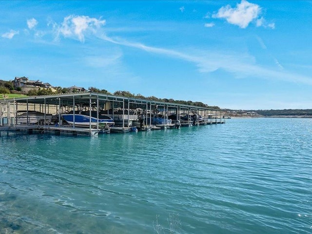 view of dock featuring boat lift and a water view