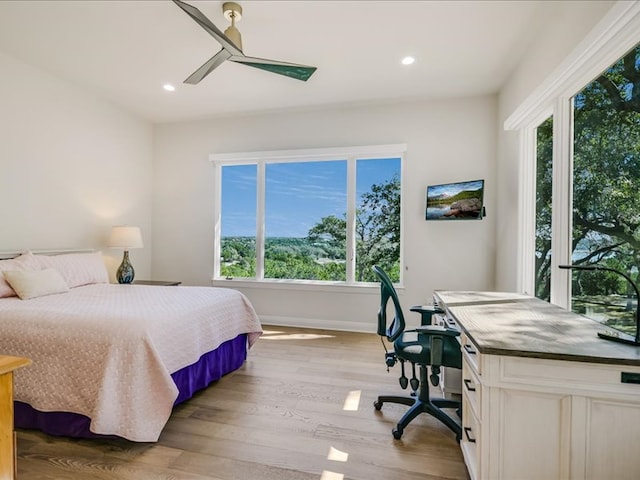 bedroom with a ceiling fan, light wood-type flooring, baseboards, and recessed lighting