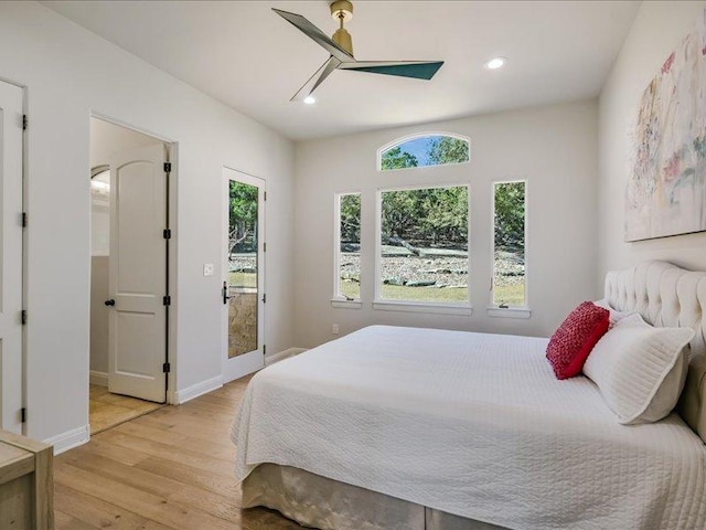 bedroom with recessed lighting, baseboards, multiple windows, and light wood finished floors