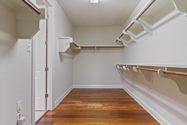 spacious closet with wood finished floors