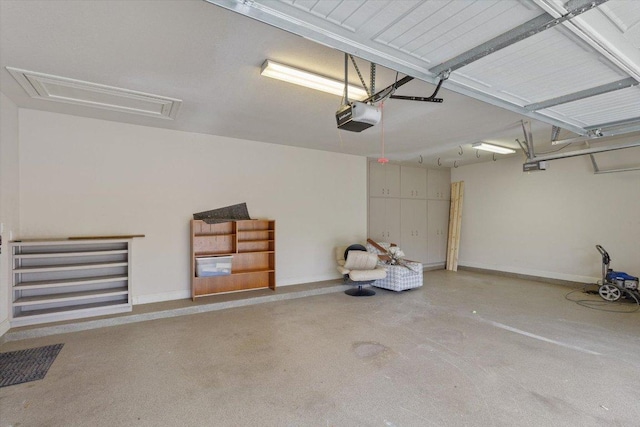 garage featuring baseboards and a garage door opener