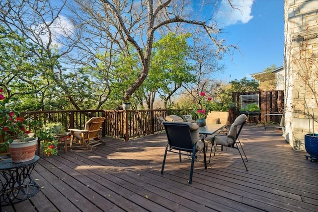 wooden deck with outdoor dining space