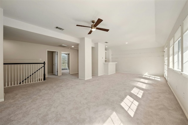 carpeted spare room with recessed lighting, visible vents, and baseboards