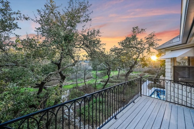 view of balcony at dusk