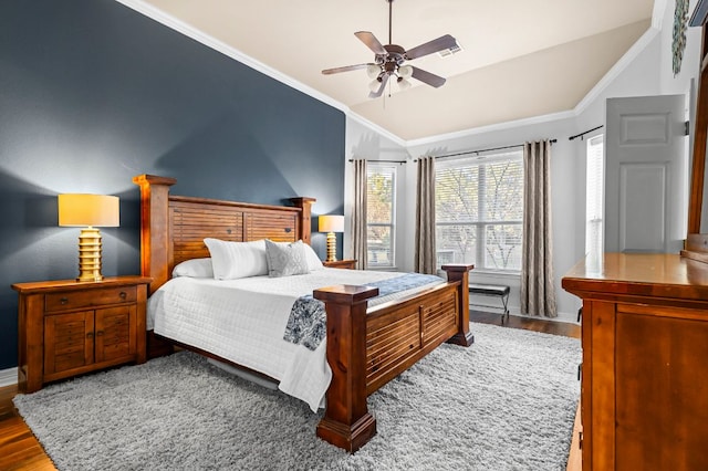 5312 Fort Benton Dr, Austin, TX 78735 - bedroom with vaulted ceiling, wood finished floors, crown molding, a ceiling fan, and baseboards