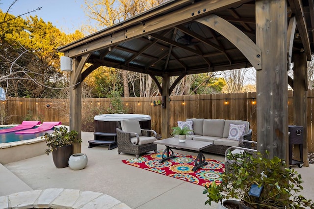 5312 Fort Benton Dr, Austin, TX 78735 - fenced backyard featuring a hot tub, a gazebo, a patio, an outdoor hangout area, and cooling unit