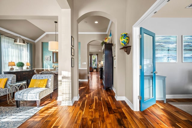5312 Fort Benton Dr, Austin, TX 78735 - foyer featuring arched walkways, wood finished floors, plenty of natural light, baseboards, and vaulted ceiling