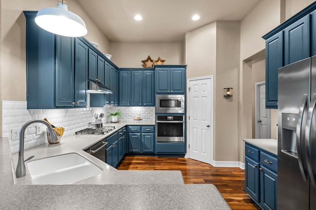 5312 Fort Benton Dr, Austin, TX 78735 - kitchen with stainless steel appliances, a sink, blue cabinetry, dark wood finished floors, and recessed lighting