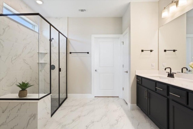 full bathroom with marble finish floor, baseboards, vanity, and a marble finish shower