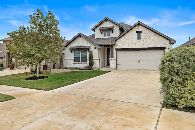 view of front facade featuring board and batten siding, a front yard, a garage, stone siding, and driveway