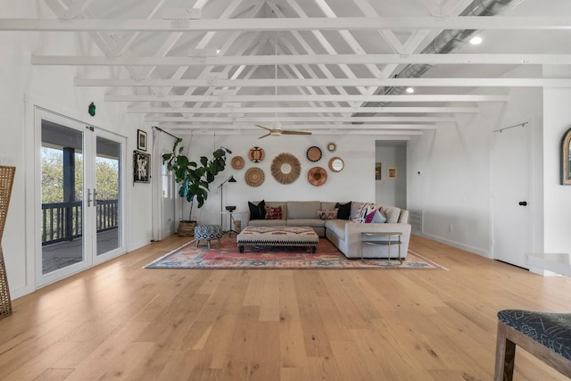 200 Hilltop Dr, Dripping Springs, TX 78620 - living room featuring beam ceiling, light wood-style flooring, french doors, and a ceiling fan