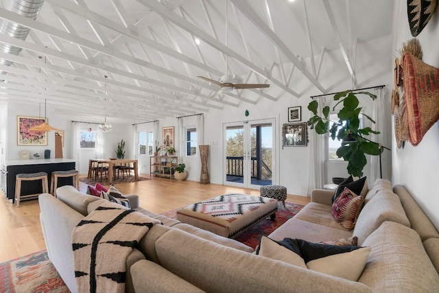 200 Hilltop Dr, Dripping Springs, TX 78620 - living room featuring light wood-style flooring, a chandelier, beamed ceiling, and high vaulted ceiling