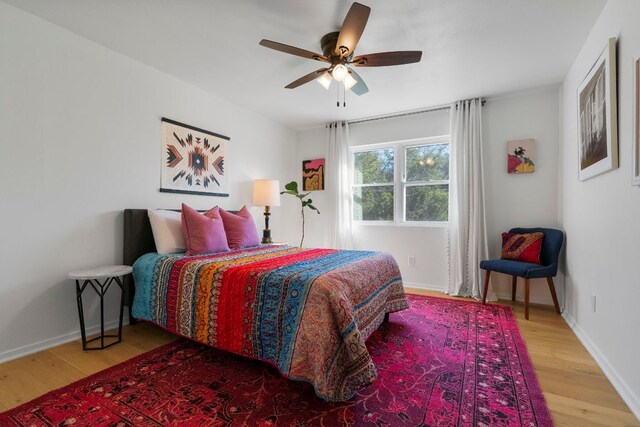 200 Hilltop Dr, Dripping Springs, TX 78620 - bedroom featuring wood finished floors and a ceiling fan