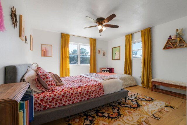 200 Hilltop Dr, Dripping Springs, TX 78620 - bedroom featuring wood finished floors and a ceiling fan