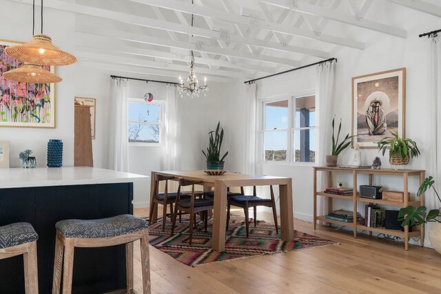 200 Hilltop Dr, Dripping Springs, TX 78620 - dining area with healthy amount of natural light, light wood-type flooring, beam ceiling, and a chandelier
