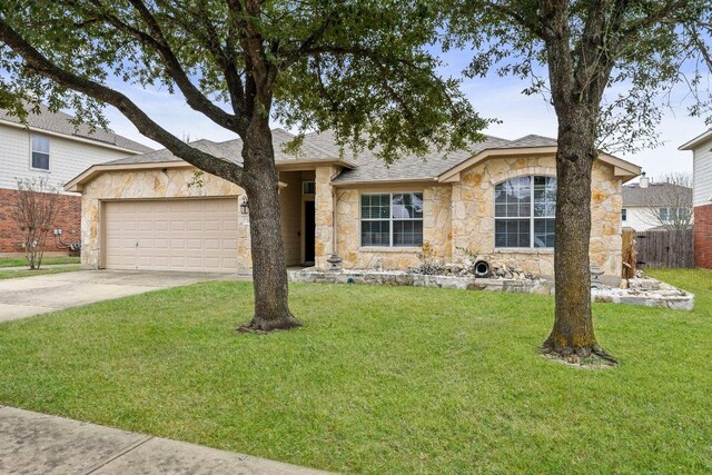 701 Portchester Castle Path, Pflugerville, TX 78660 - single story home featuring stone siding, a garage, driveway, and a shingled roof