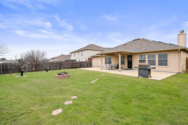 701 Portchester Castle Path, Pflugerville, TX 78660 - back of house featuring a chimney, a patio area, and a fire pit