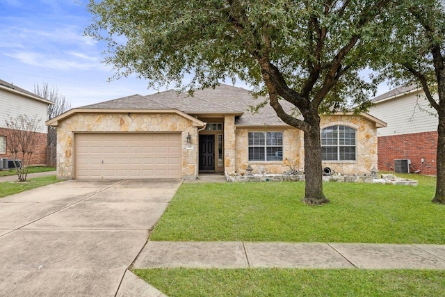 single story home featuring an attached garage, central AC unit, stone siding, driveway, and a front lawn