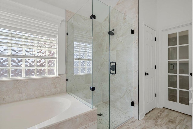 701 Portchester Castle Path, Pflugerville, TX 78660 - full bathroom with a garden tub and a marble finish shower