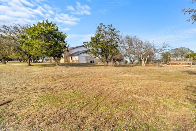 view of yard featuring a wooden deck