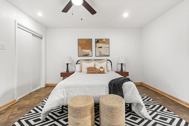 bedroom with recessed lighting, concrete floors, baseboards, and ceiling fan