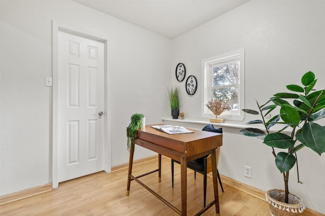 office area with light wood-style floors