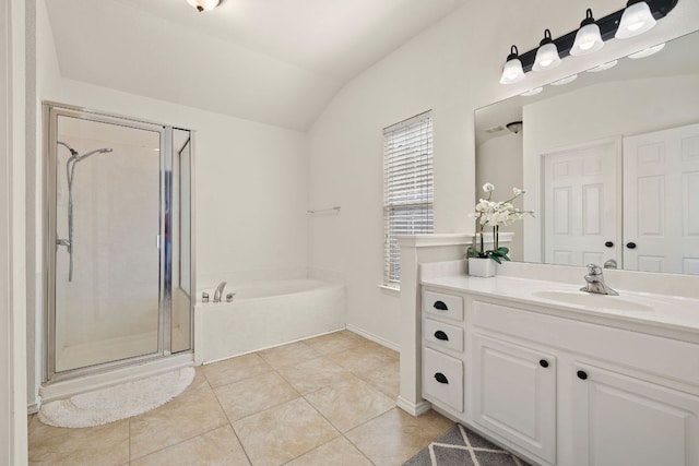 full bath featuring tile patterned flooring, a garden tub, vanity, vaulted ceiling, and a stall shower