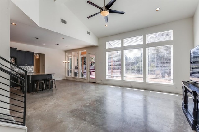 living area featuring recessed lighting, visible vents, ceiling fan, high vaulted ceiling, and concrete flooring