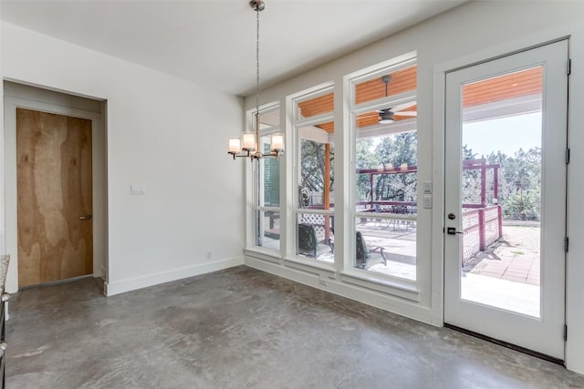 14805 Foy Dr, Austin, TX 78734 - unfurnished dining area featuring unfinished concrete flooring, a chandelier, and french doors