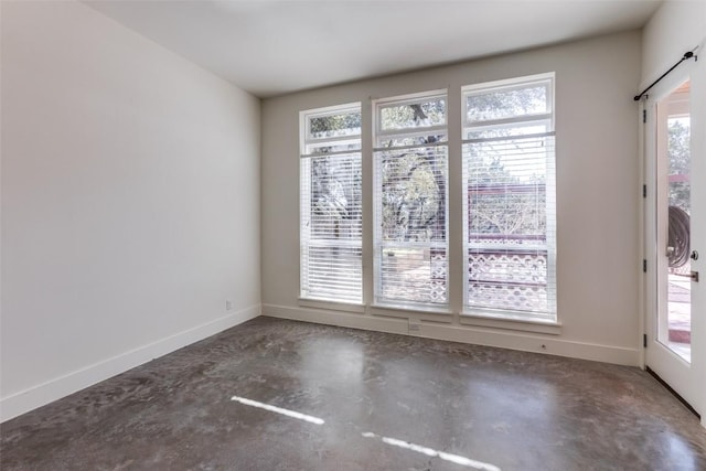 14805 Foy Dr, Austin, TX 78734 - spare room with concrete flooring and baseboards
