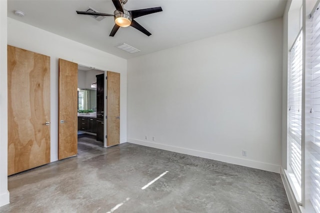 14805 Foy Dr, Austin, TX 78734 - unfurnished bedroom with concrete flooring, ensuite bathroom, and ceiling fan