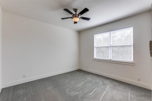 unfurnished room with carpet, ceiling fan, and baseboards