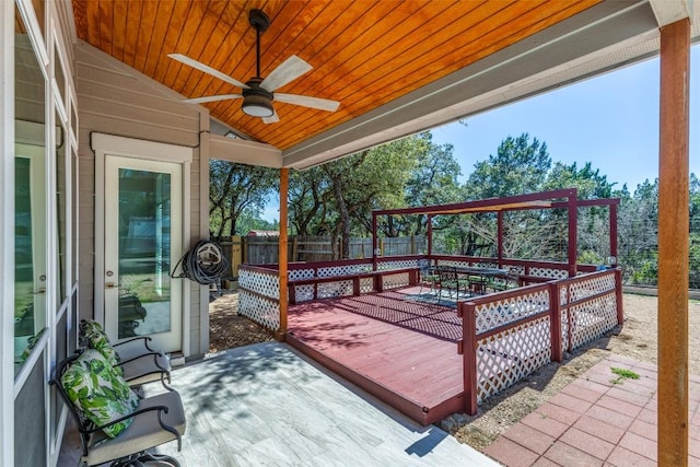 wooden deck featuring ceiling fan, outdoor dining space, and fence