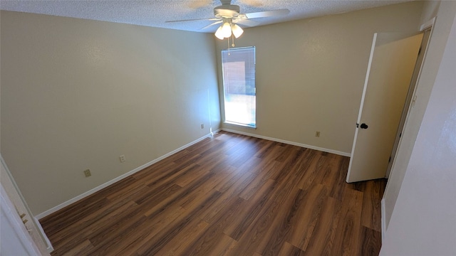 unfurnished bedroom with a textured ceiling, ceiling fan, wood finished floors, and baseboards