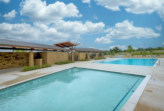 community pool featuring a patio