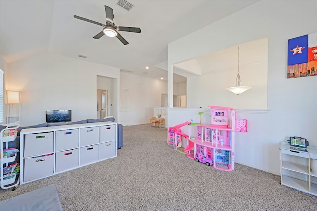 rec room featuring lofted ceiling, ceiling fan, carpet, and visible vents