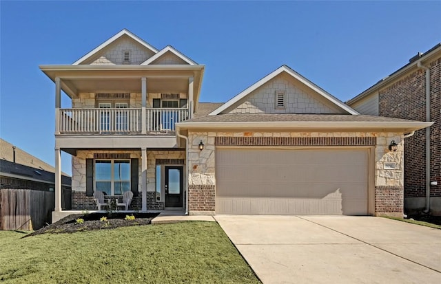504 Allende Bnd, Austin, TX 78748 - view of front of house with a balcony, stone siding, covered porch, and driveway