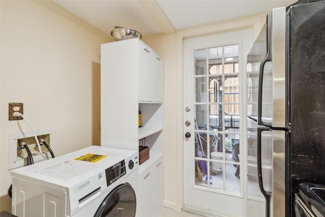 washroom featuring laundry area and washer / clothes dryer