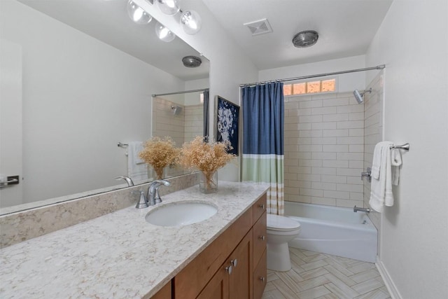 bathroom featuring shower / bath combo, baseboards, visible vents, toilet, and vanity