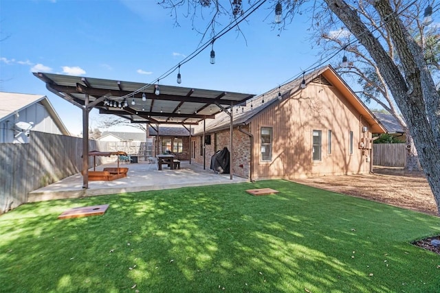 back of property featuring a patio area, a fenced backyard, and a lawn