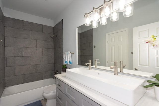 bathroom with shower / washtub combination, vanity, and toilet