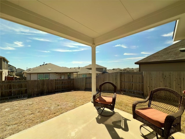 171 Longstraw Dr, Buda, TX 78610 - fenced backyard featuring a patio and a residential view